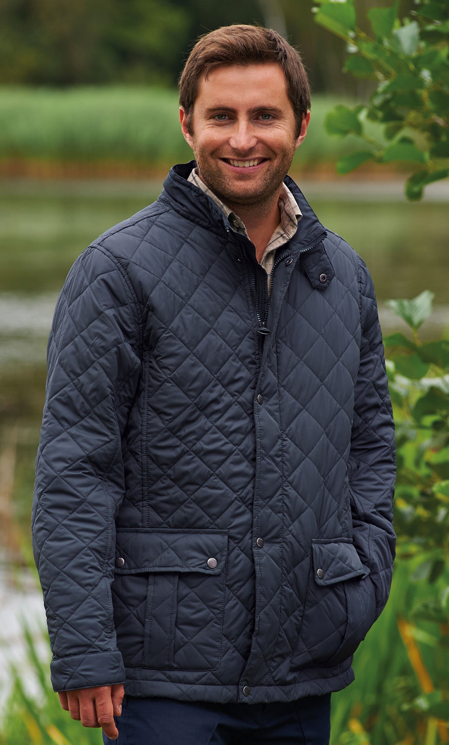 Man wearing diamond quilted country jacket navy