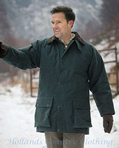 man in winter wearing The Hoggs of Fife Padded Waxed Jacket inolilve